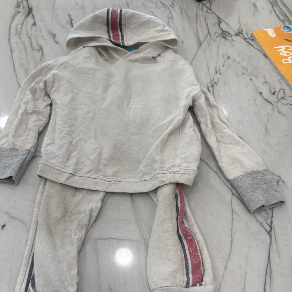 Splendid Cream and Gray Apparel with Red Accents